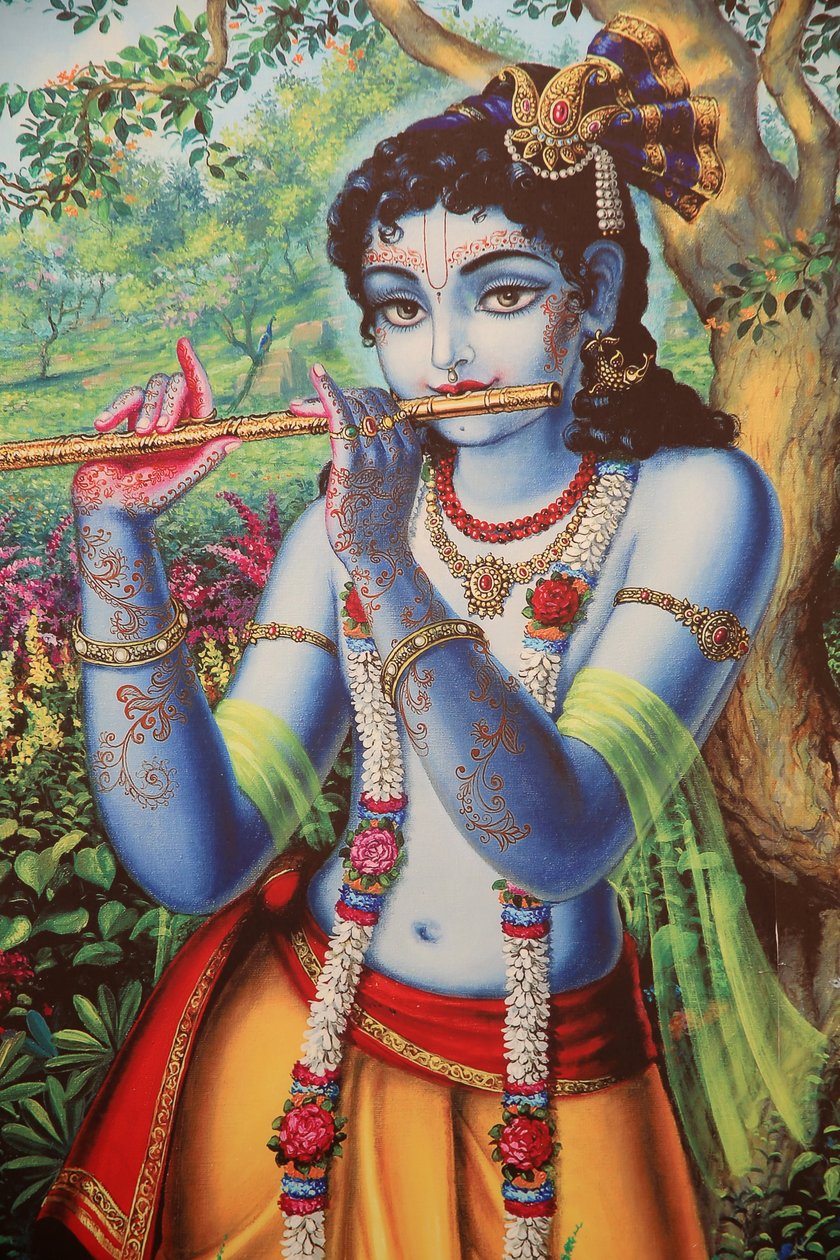 हिंदू भगवान कृष्ण को बाहर बांसुरी बजाते हुए चित्रित किया गया चित्र। इंडिया द्वारा अज्ञात