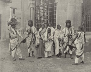 सौडानीज की मंडली द्वारा अमेरिकी फोटोग्राफर