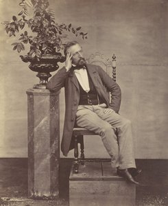 [मैथियास हॉउसरमैन कुरसी पर कुरसी के साथ फूलों का फूलदान लिए बैठे], 1850-60 के दशक। द्वारा फ्रांज एंटोनी