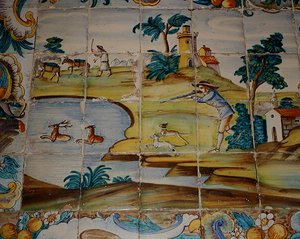 अज़ुलेजोस टाइलें एक शिकारी को हिरण (सिरेमिक) को मारने का चित्रण करती हैं द्वारा स्कूल स्पेनिश
