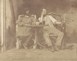 1850 के दशक में एक मेज पर बैठे दो आदमी। द्वारा अज्ञात