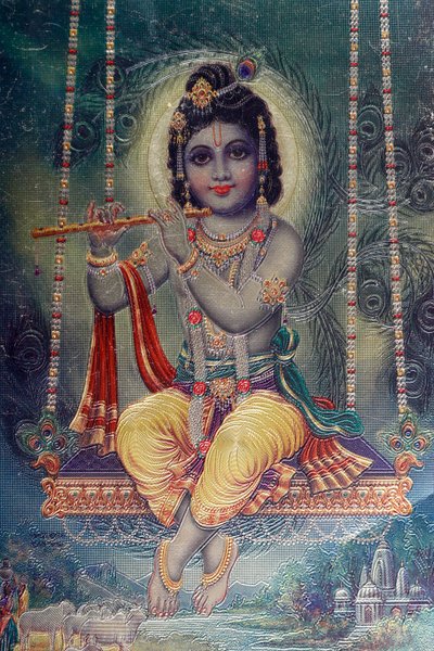 भगवान कृष्ण बांसुरी के साथ। हिंदुओं के देवता। द्वारा . .